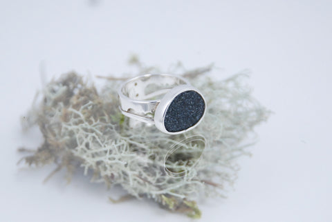 Silver ring with black raw stone and plagioclase