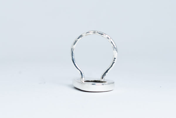 Shimmering black seaside stone ring.