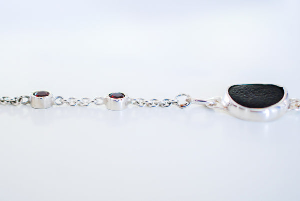 Silver bracelet with natural black stone and red garnets
