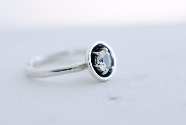 Silver engagement statement ring with white topaz