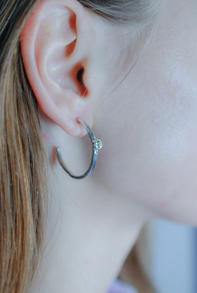Silver hoops earrings with green peridot stone