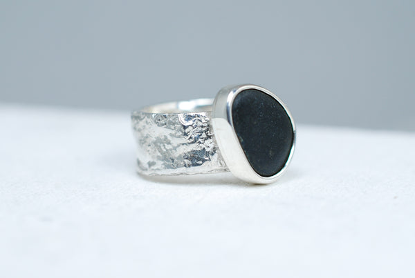 Wide band black stone ring