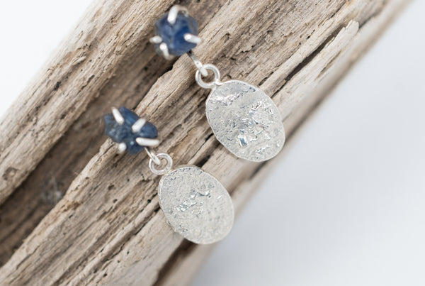 Silver earrings with raw blue sapphire