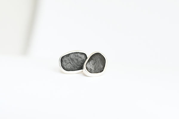 Black beach stone set in silver bezel. Handmade stud earrings