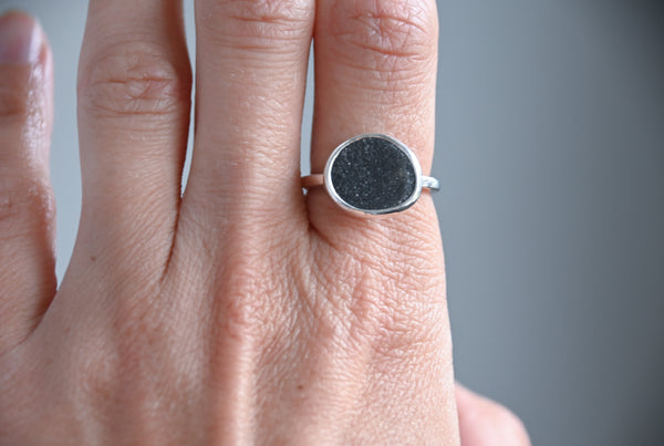 Shimmering seaside stone ring.