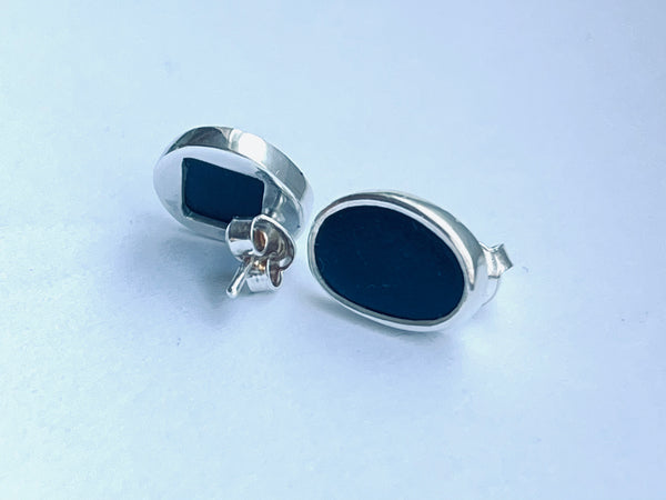 Silver stud earrings with raw Black stone
