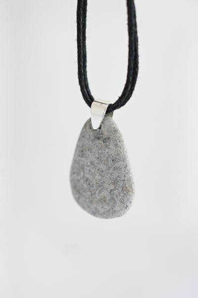 Necklace with a gray pendant on a black cotton cord. Summer vibes