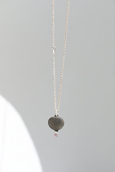 Rough Baltic seashore pebble and pink sapphire necklace with silver chain