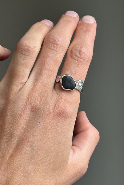 Silver ring with a black stone and blue topaz. Inspired by nature
