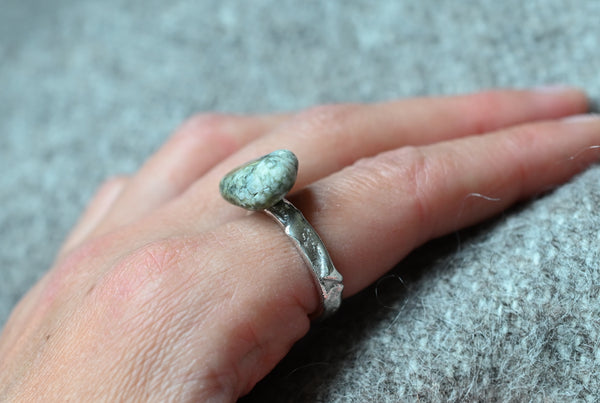 Handmade silver ring with green seashore pebble. Silver jewellery.