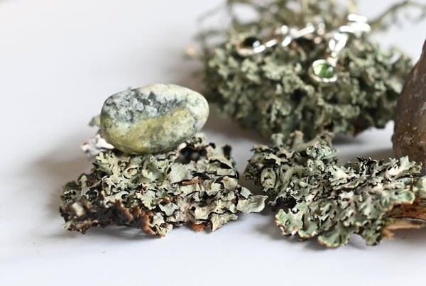 Handmade silver ring with green-grey pebble