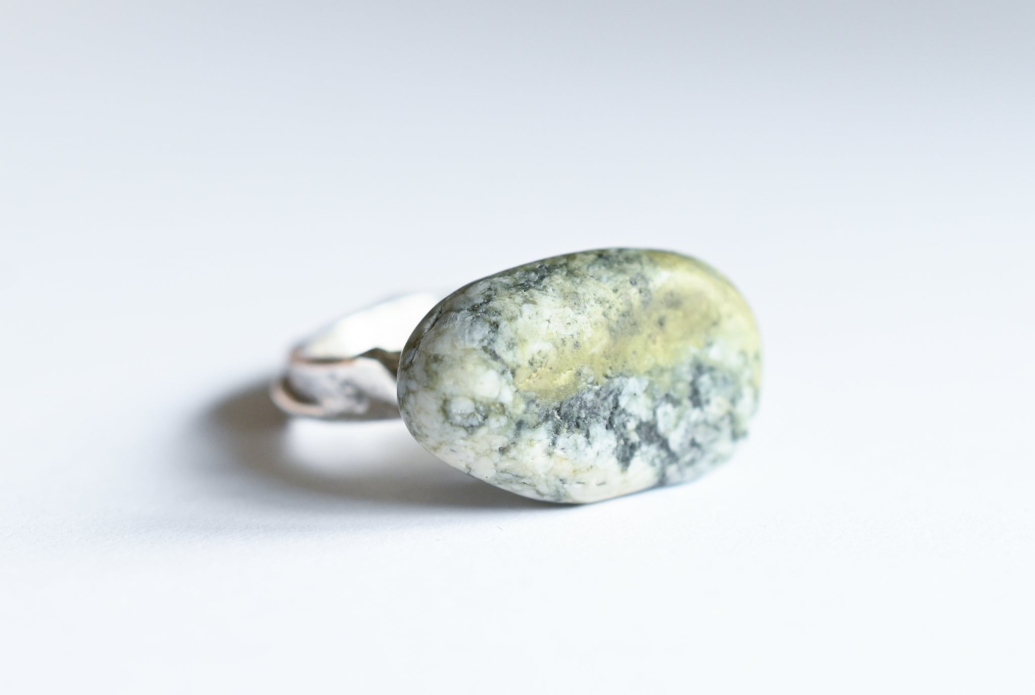 Handmade silver ring with green seashore pebble. Silver jewellery.