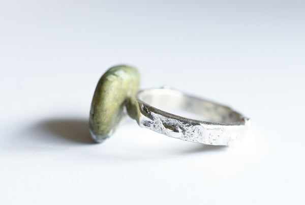 Handmade silver ring with green seashore pebble. Silver jewellery.