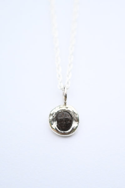 Sterling silver pendant with black rough stone