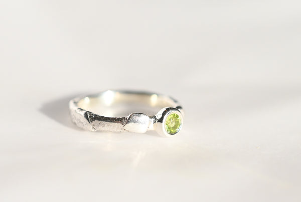 Handmade silver ring with green peridot gemstone. 