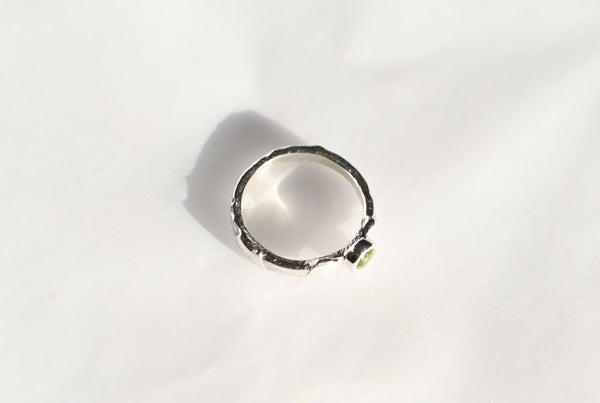 Handmade silver ring with green peridot gemstone. 