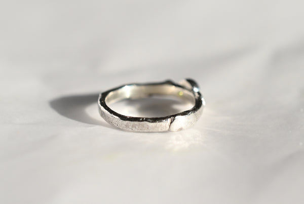 Handmade silver ring with green peridot gemstone. 