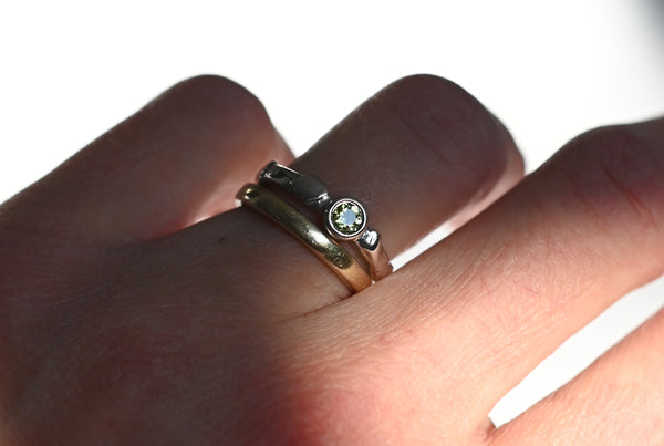 Handmade silver ring with green peridot gemstone. 