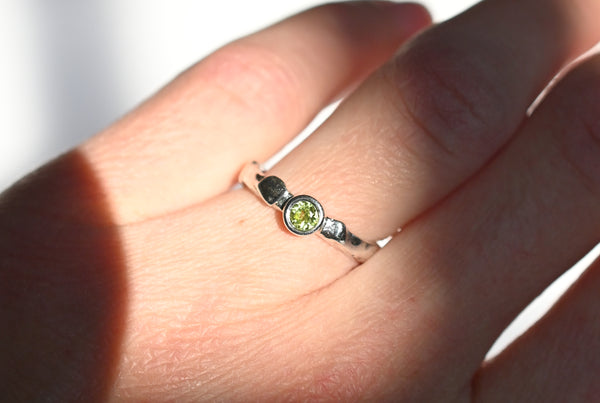 Handmade silver ring with green peridot gemstone. 
