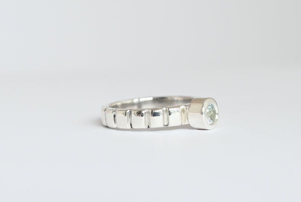 Vertical line silver band ring with aquamarine