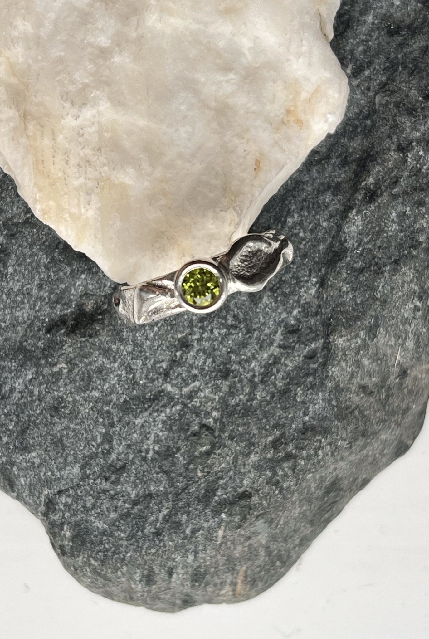 Handmade silver ring with green peridot stone.