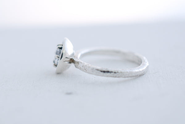 Silver engagement statement ring with white topaz