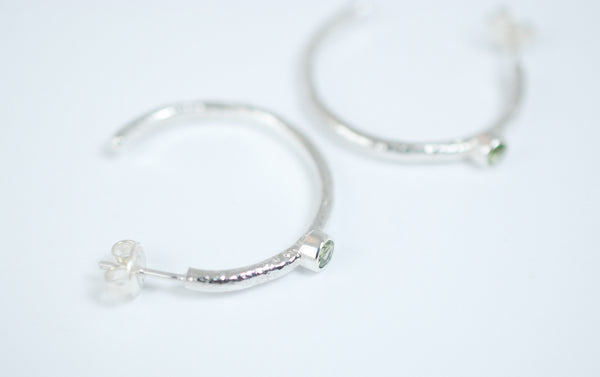 Silver hoops earrings with green peridot stone