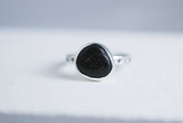 Silver ring with black stone