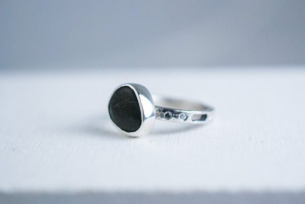 Silver ring with black stone