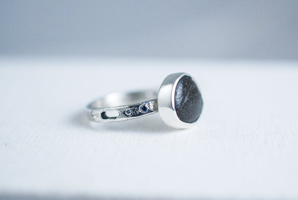 Silver ring with black stone