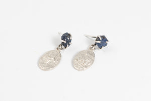 Silver earrings with raw blue sapphire