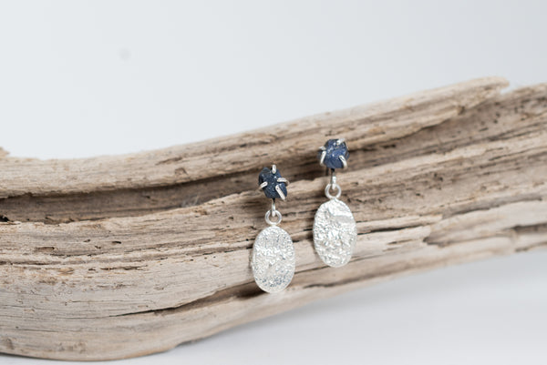 Silver earrings with raw blue sapphire