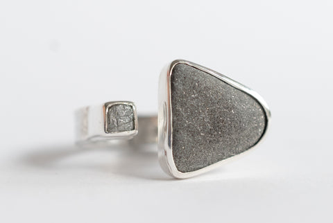 Rough grey diamond and seaside stone