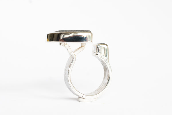 Rough grey diamond and seaside stone