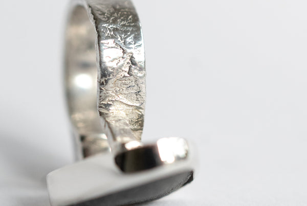 Rough grey diamond and seaside stone