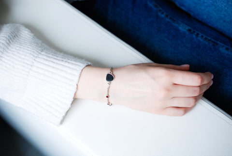 Silver bracelet with natural black stone and red garnets