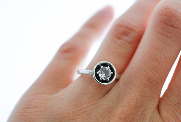 Silver engagement statement ring with white topaz